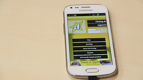 Una imatge de l'aplicació en un terminal mòbil, per utilitzar, i votar al caganer.