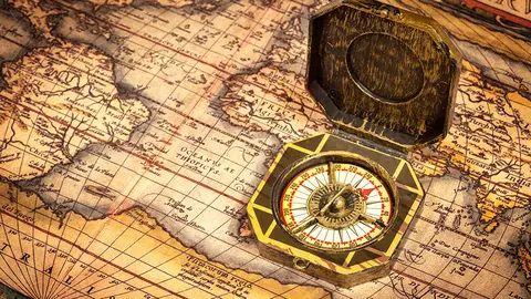 Vintage pirate retro compass on ancient world map